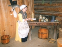 Woman at table in Fort Delaware